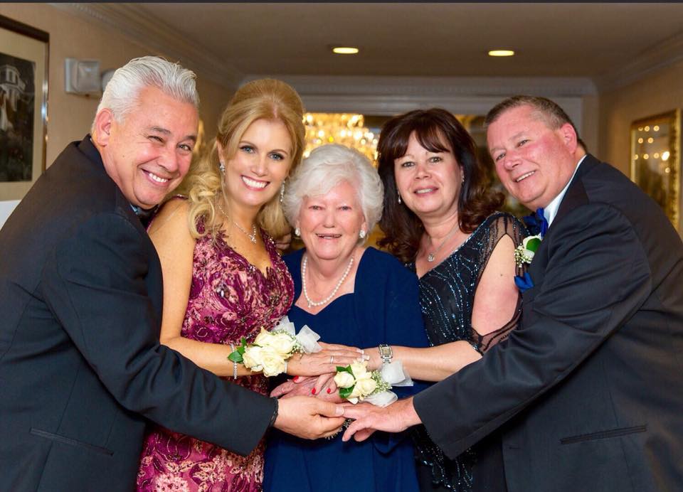 Helen Curra and her family celebrating a wedding