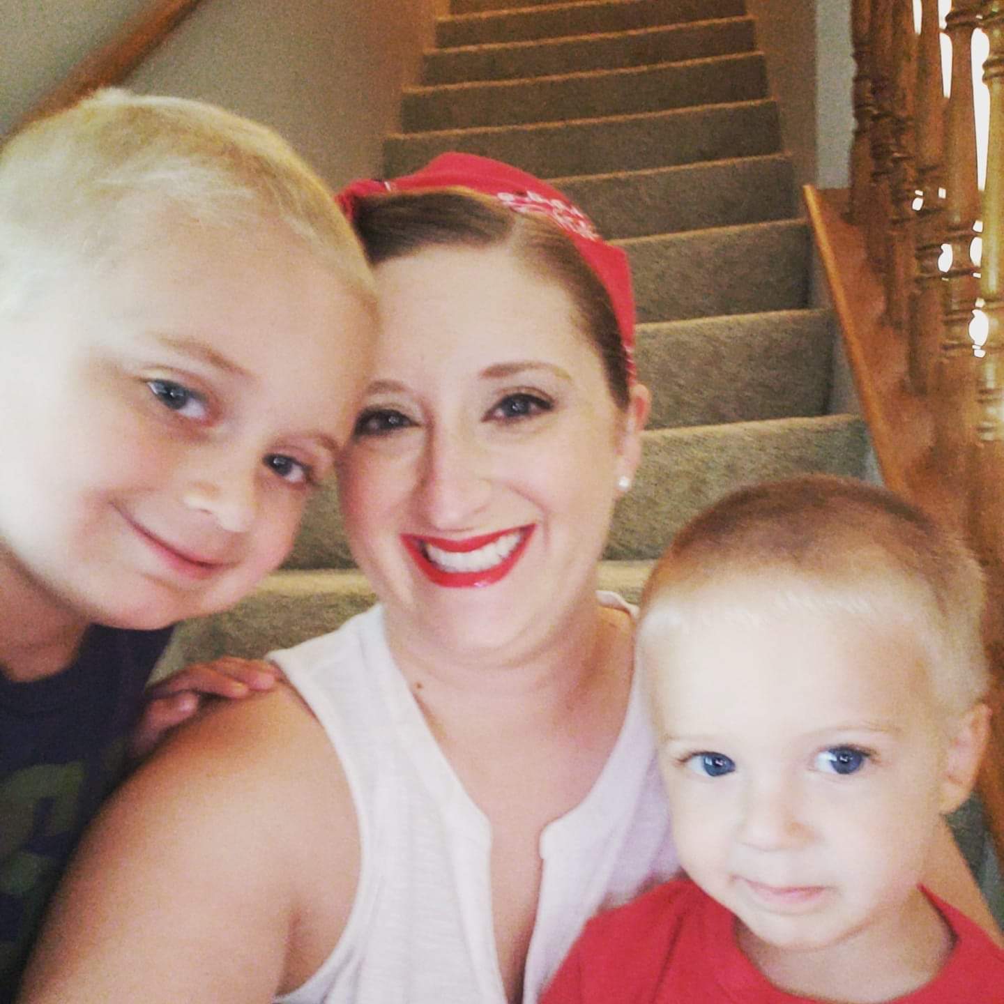 Laura Meents and her kids at the bottom of the steps at their house