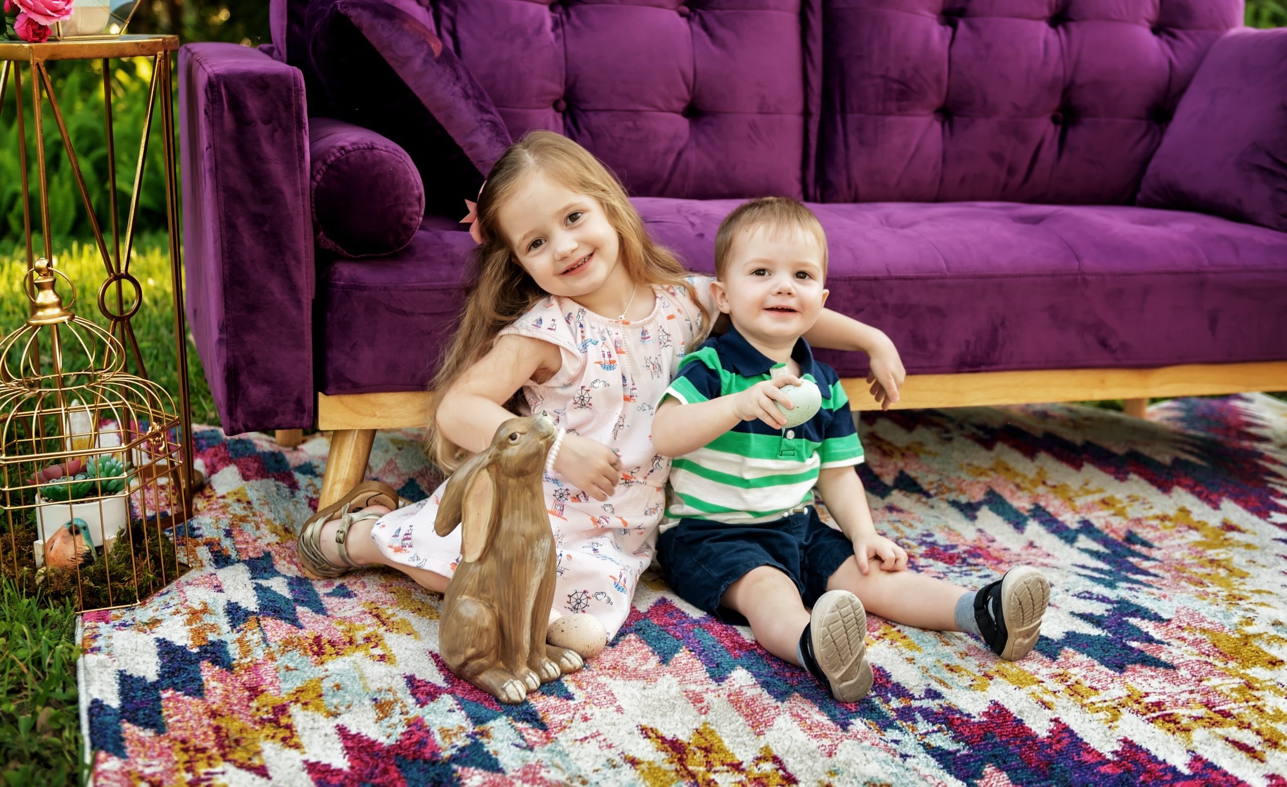 Kate Sherwin's kids (Lyla and Noah) on Easter in front of a purple couch