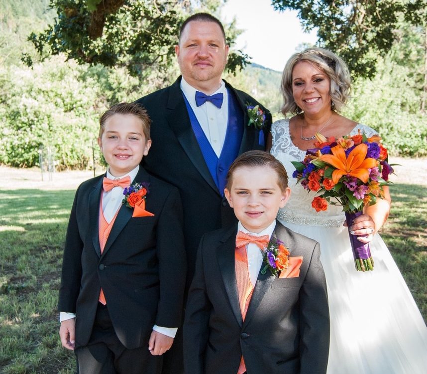 Amie and Keith Brewer celebrating their wedding with their boys