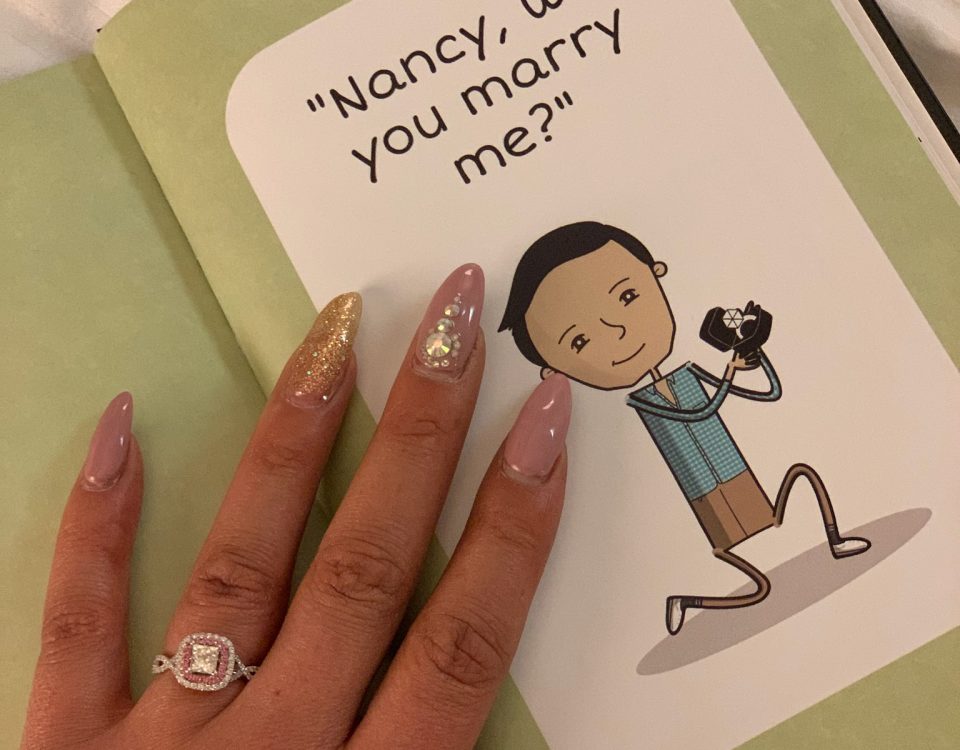 picture of cartoon book asking, 'Nancy, will you marry me?'