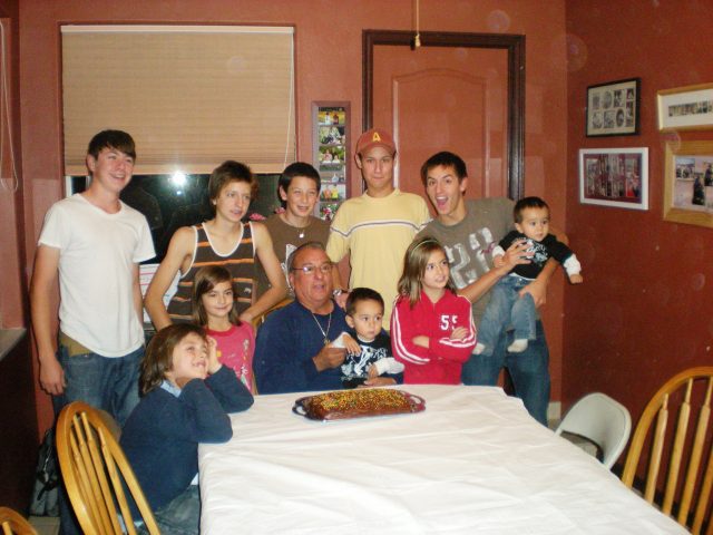 the perez family celebrating thanksgiving with a cake in 2009