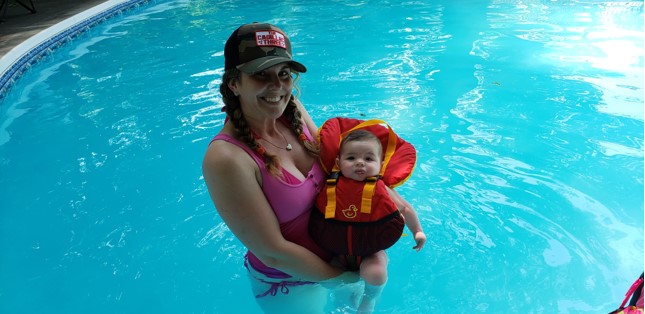 Lindsay Geeson with son Ryan swimming in the pool