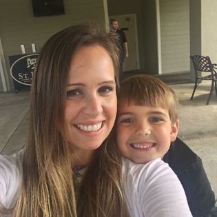 Lyndsey Cartledge and son smiling in the house