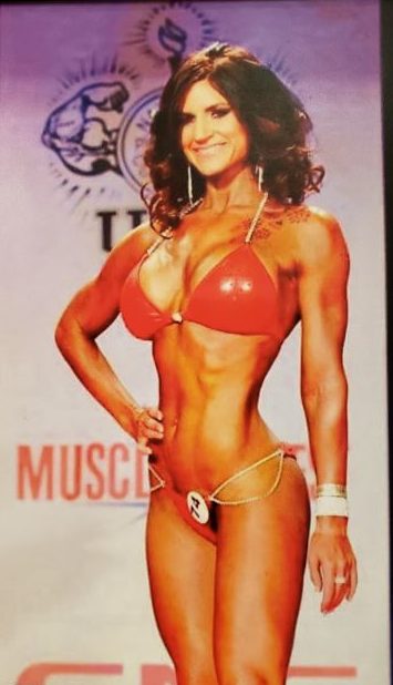 female bodybuilder Andrea Andersen standing in her bikini at a competition