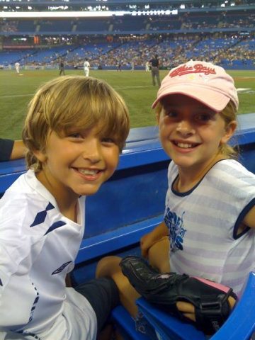 Paula Scott's kids sitting first row at the Toronto Blue Jays game