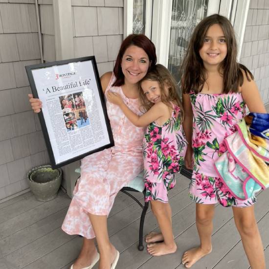 @Bjmac10Bjmac holding her story 'A Beautiful Life' with her daughters by her side