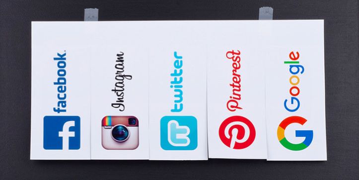 social media icons on paper (Facebook, Instagram, Twitter, Pinterest, Google)