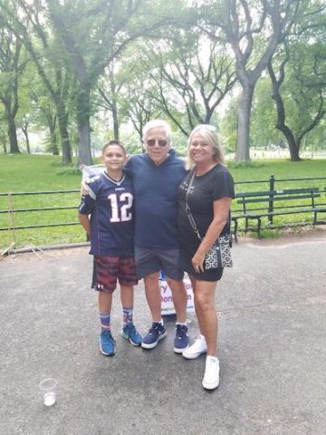 New England Patriots owner Robert Kraft with Lori Allen and her son