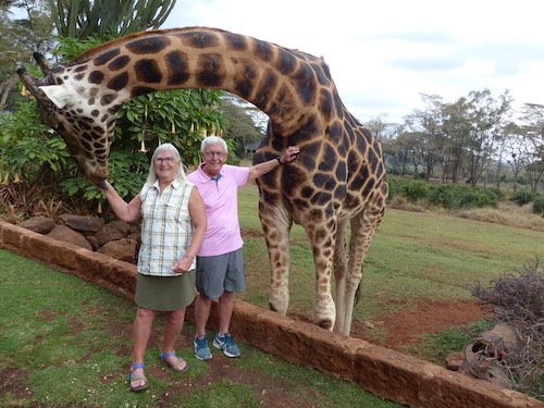 couple with giraffe