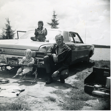 Brian Edmondson with his kids working on his old car back in the day