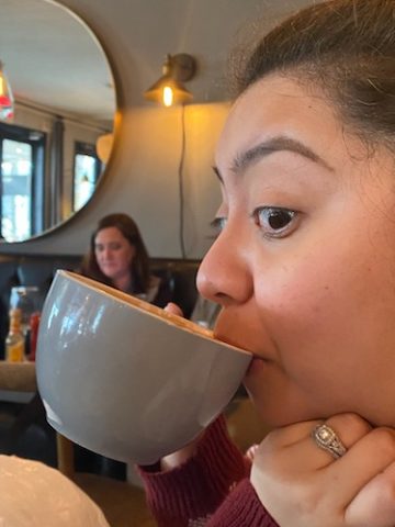 Andrea Murphy sipping out of a coffee mug