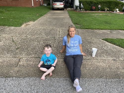 Nicole Farris and her son chilling at the end of the driveway