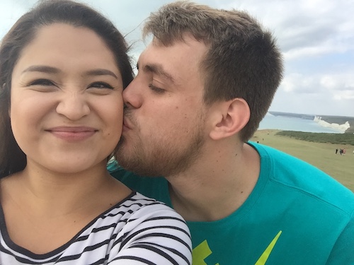 Daisy and Shane Sargent hanging out at the beach and planting a kiss on the cheek