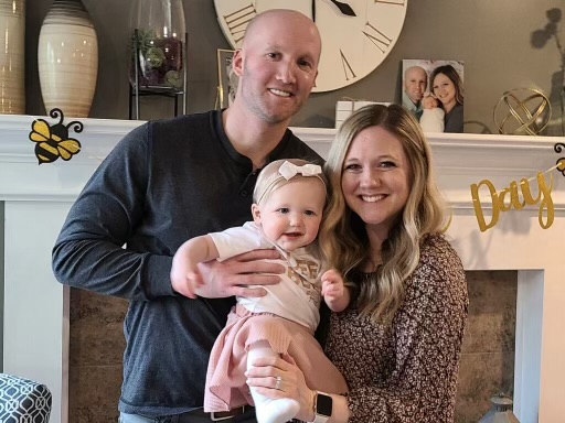 Kristina Johnson with her husband and their baby girl
