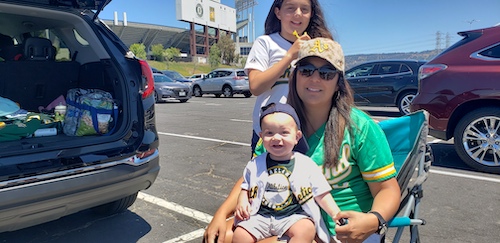 Sadie Marie with kids tailgating outside of Oakland-Alameda County Coliseum