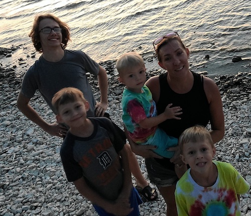 Alayna Cox and her sons chilling on the rocks by the water