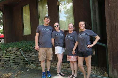 Leslie Hodges with her family wearing matching shirts outside