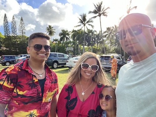 Annie Camacho with her husband and children wearing sunglasses