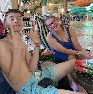 Mandy Beiber and her son hanging out by the indoor pool
