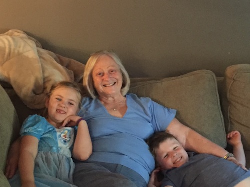 Sharon Grapengieser with grandkids hanging out on the couch