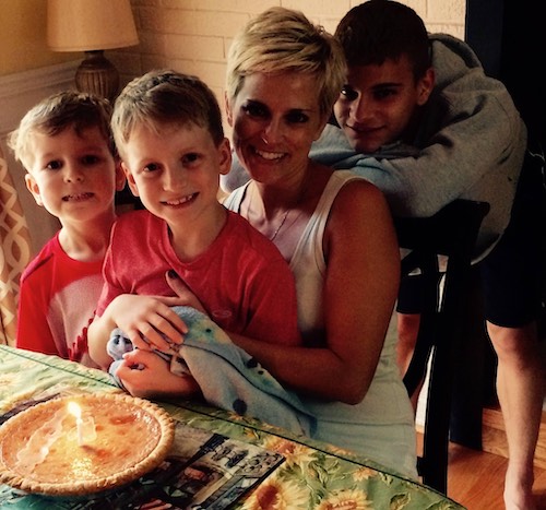 Julia LaCava handing out with her three sons eating pie