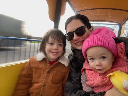 Gabrielle D’Amore and her kids bundled up on a ride