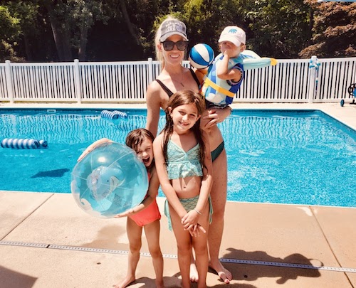 Julia Markowski and and her three kids hanging out by the pool
