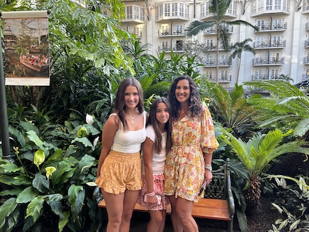 Gianna Mohrman and her girls in front of the palms