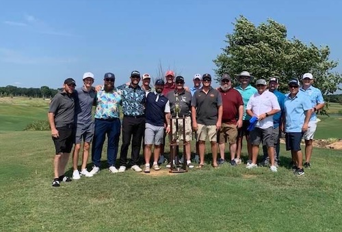2022 Doug Hartis Invitational (DHi) participants on the golf course with the golf major's trophy