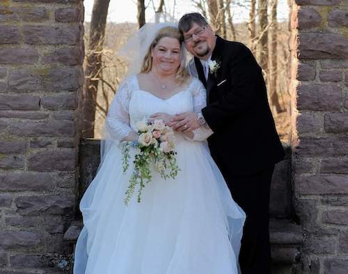 Tina Walker with her husband Adam Guilick on their wedding day