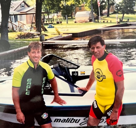 Richard Grodus having out outside their speedboat with his son Michael
