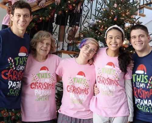 Zulima Medina and her family wearing matching Christmas pajama shirts