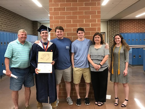 Kathy Brooker and her family at a high school graduation celebrating