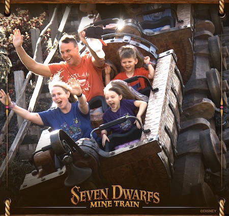 Cindy Bleil and her family riding the Seven Dwarfs Mine Train