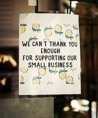 sign that says, "we can't thank you enough for supporting our small business"