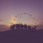 tossing graduation hats into the sunset and making a half circle