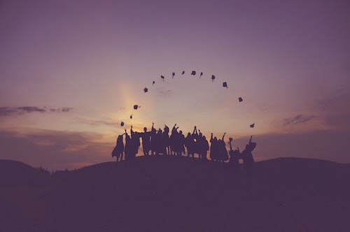 tossing graduation hats into the sunset and making a half circle
