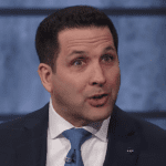 Adam Schefter with a surprised/upset facial expression in the ESPN studio