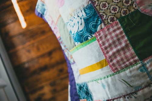 Close-up of a colorful DIY quilt, one of the best gifts for non-traditional occasions.