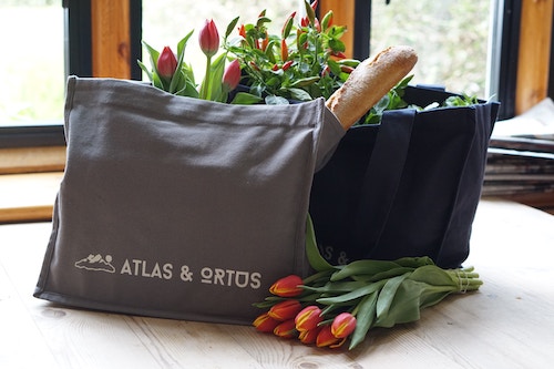 reusable shopping bag with flowers and bread